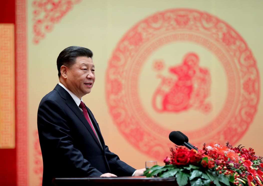 Chinese President Xi Jinping addresses a Chinese Lunar New Year reception at the Great Hall of the People in Beijing.