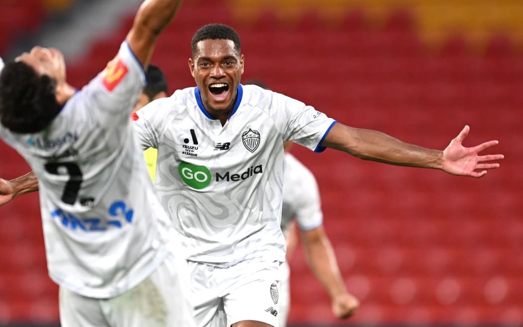 Dan Hall of Auckland FC celebrates the goal of Hiroki Sakai (L) against Brisbane Roar.