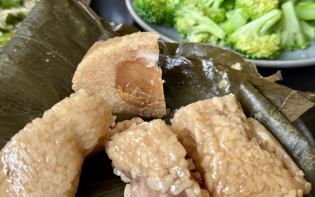 A traditional Chinese sticky rice dumpling filled with pork and salted egg yolk.