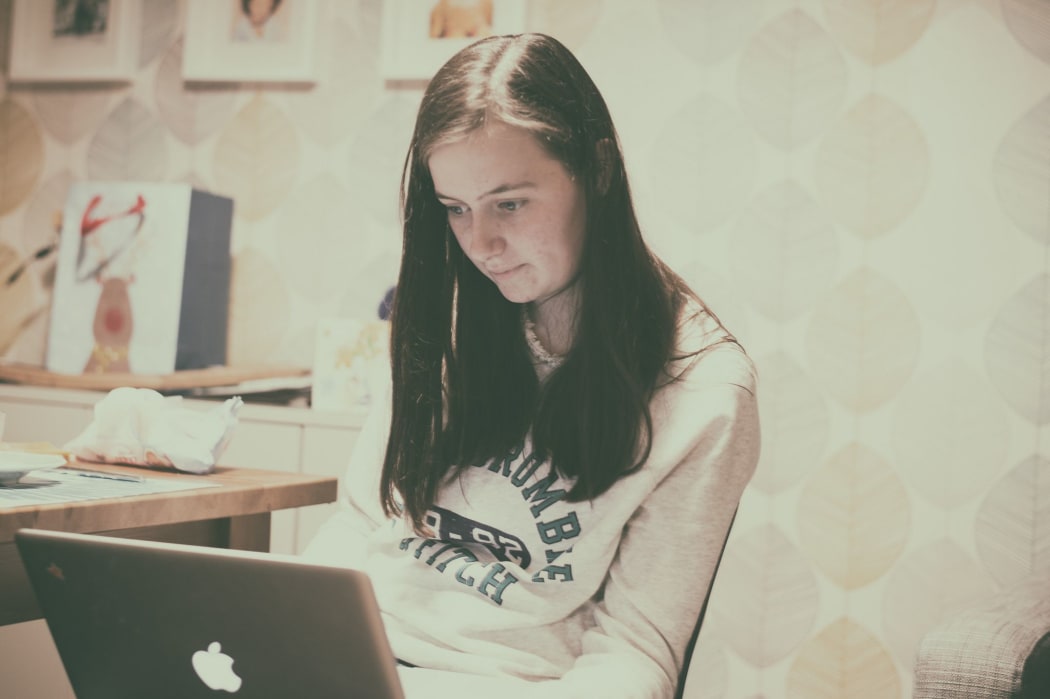 teenage girl on laptop