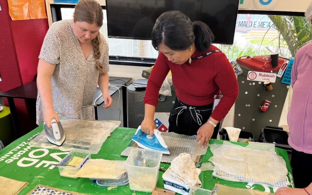 30112023, WWA Wen Yang and Emma Burges, making bees wax wraps at the workshop for a Chinese group in Northcote Library
