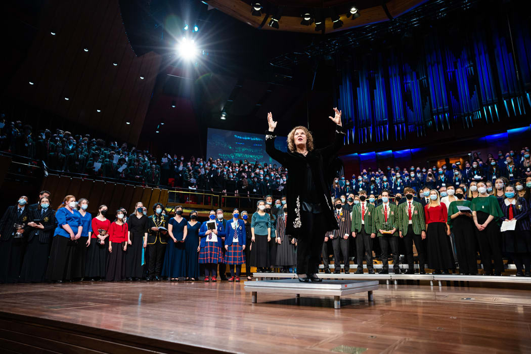 Sue Densem conducting The Big Sing 2022 massed choir at the Christchurch Town Hall