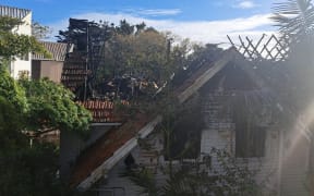 The scene of the house fire that closed the Shelly Bay off-ramp.