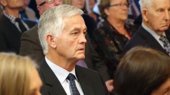 Richie McCaw's father watches as his son receives New Zealand's highest honour.