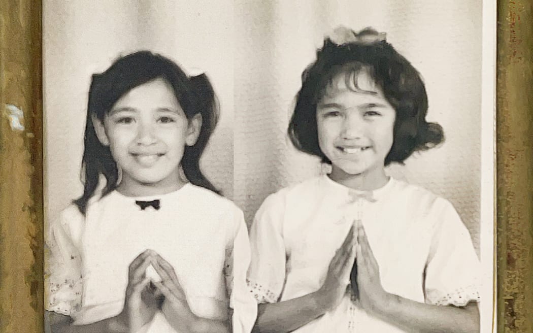 Joyce Harris (left) and her twin sister Toni, as children in an old family photo.