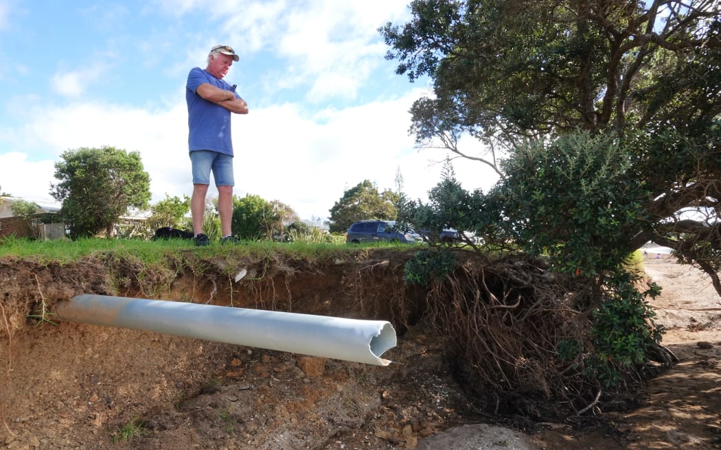 Long-time Paihia resident Ross Robertson inspects the disappearing Waitangi waterfront.