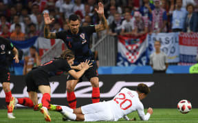 England's midfielder Dele Alli (R) is fouled during the Russia 2018 World Cup semi-final football match between Croatia and England at the Luzhniki Stadium in Moscow on July 11, 2018. / AFP PHOTO / MANAN VATSYAYANA / RESTRICTED TO EDITORIAL USE - NO MOBILE PUSH ALERTS/DOWNLOADS