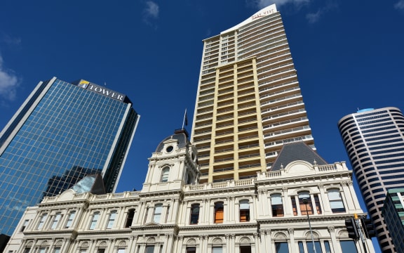 Auckland old Customhouse under modern building. Since the 19th century European settlement Auckland become the fastest-growing and commercially dominating city of New Zealand