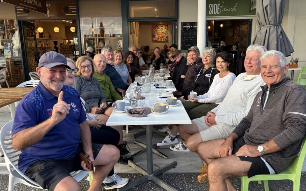 Colin McGonagle, front left, with friends at Side Track cafe in Mount Maunganui.