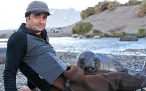 Rob Suisted with Elephant Seal pup on South Georgia