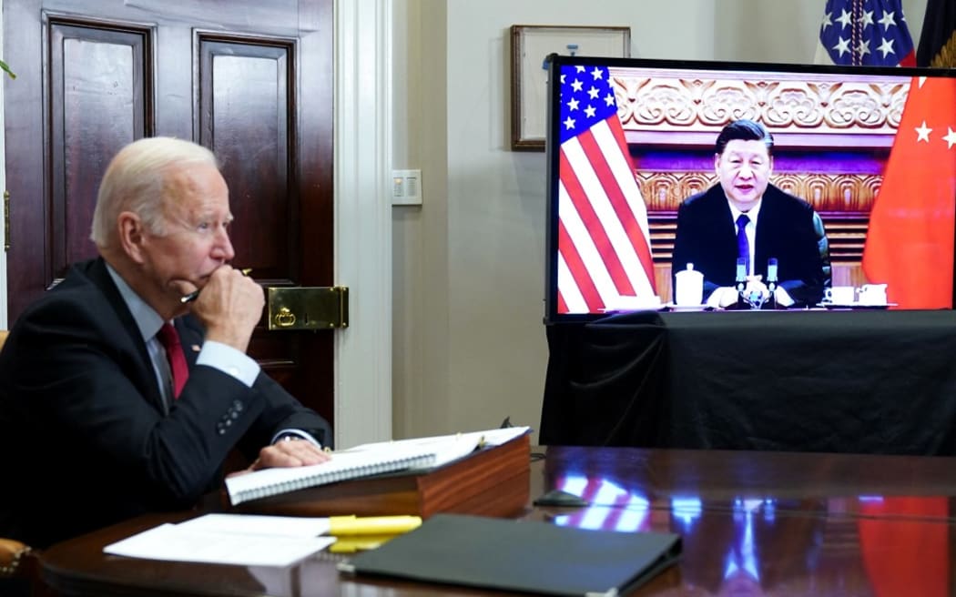 (FILES) In this file photo taken on November 15, 2021 US President Joe Biden meets with China's President Xi Jinping during a virtual summit from the Roosevelt Room of the White House in Washington, DC.