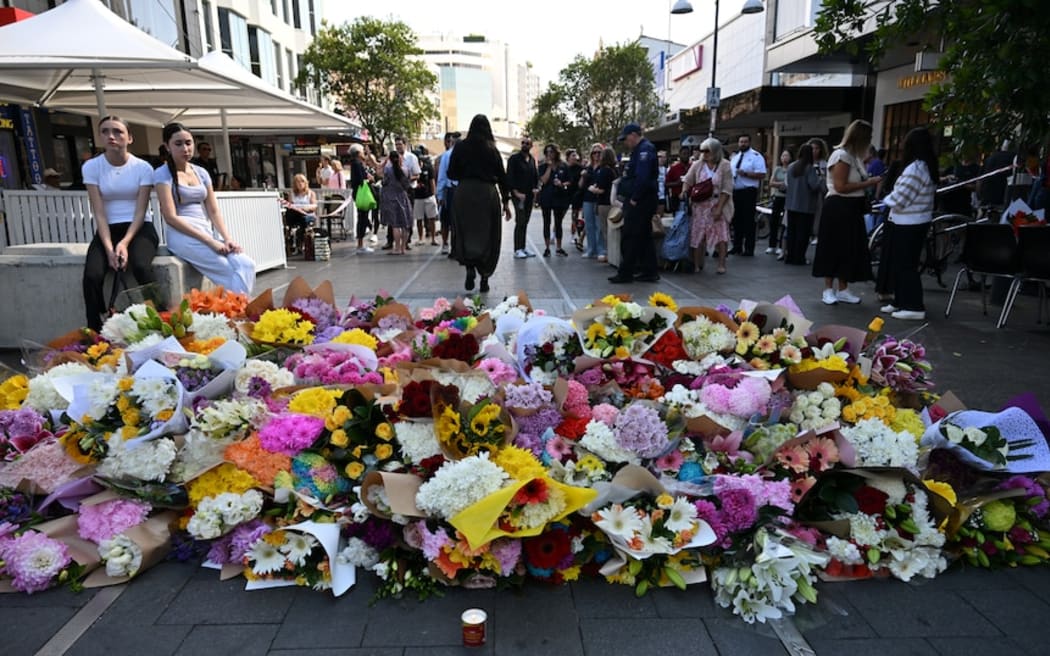 In the days after the attack, a sea of flowers bloomed on the pavement outside the shopping centre as people came to pay their respects.
