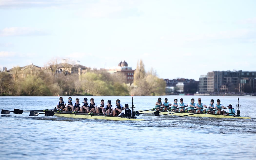 Teams compete in the 169th men's boat race between Oxford University and Cambridge University on the River Thames in London on March 30, 2024. The Boat Race was first raced by crews from Oxford and Cambridge University in 1829 and is now one of the world's oldest and most famous amateur sporting events. (Photo by HENRY NICHOLLS / AFP)