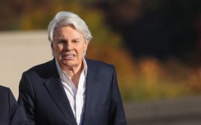 CENTRAL ISLIP, NEW YORK - OCTOBER 25: Former Abercrombie & Fitch CEO Mike Jeffries leaves a Long Island court with members of his legal team after pleading not guilty to sex-trafficking charges allegedly involving young male models on October 25, 2024 in Central Islip, New York. Jeffries, who is 80, was released on a $10 million bond and answered to 16 counts against him.   Spencer Platt/Getty Images/AFP (Photo by SPENCER PLATT / GETTY IMAGES NORTH AMERICA / Getty Images via AFP)