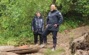 Katie Fitzpatrick (left) with Minister for Emergency Management Kiri Allan after flooding in Gisborne left the resident's property covered in mud.
