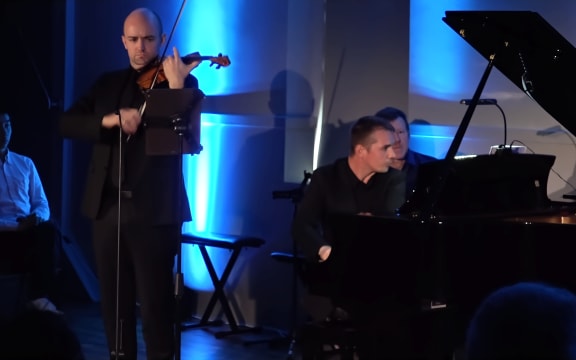 Benjamin Baker and Daniel Lebhardt on stage.