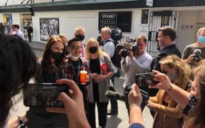 Labour leader Jacinda Ardern takes a photo with a member of the public in Newmarket, Auckland during the 2020 campaign trail.