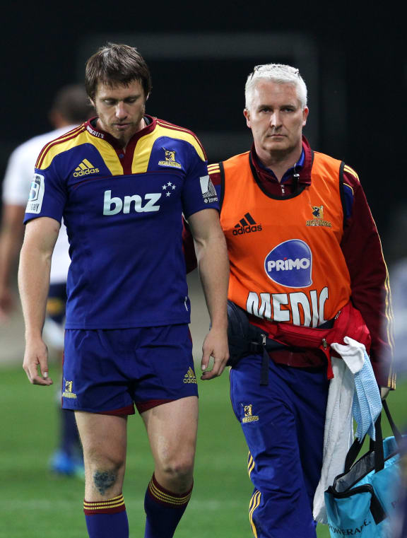 Ben Smith leaves the field after suffering a concussion during a Super Rugby match in April 2012.