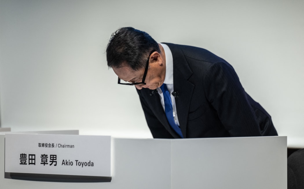 Toyota Motor Corporation Board Chairman Akio Toyoda bows during a press conference in Tokyo on June 3, 2024. Toyota said on June 3 it had suspended domestic shipments of three car models after falling foul of government certification rules along with its Japanese rivals Honda, Mazda, Suzuki and Yamaha.