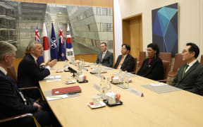 NATO Secretary General Jens Stoltenberg (second from left) speaks with Australia’s deputy head of mission David Dutton (fourth from right), Japan’s Foreign Minister Yoshimasa Hayashi (third from right), New Zealand’s Foreign Minister Nanaia Mahuta (second from right) and South Korea’s Special Representative Lee Do-hoon (right) after the Ministers of Foreign Affairs meeting at the NATO headquarters in Brussels on 5 April, 2023.