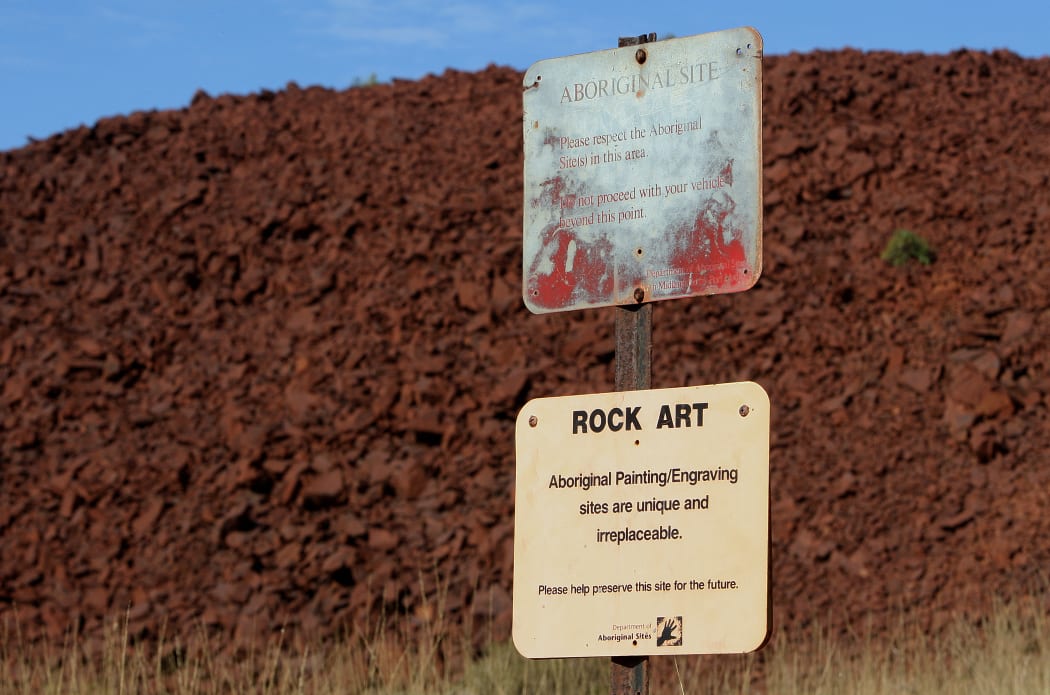Preservation signs mark an Aboriginal rock engraving site near Deep Gorge, Western Australia, considered to by some as one of the greatest concentrations of such ancient art in the world. The area is also home to increasing industrial activity that threatens the rock images.