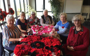 Knitters from Churton Park and Kāpiti, from left, Christine McEwan, Cheryl Brownrigg, Helen McDiarmid, Sue Grant, Pat Vincent, Caroline Smith at Kāpiti Coast Airport.