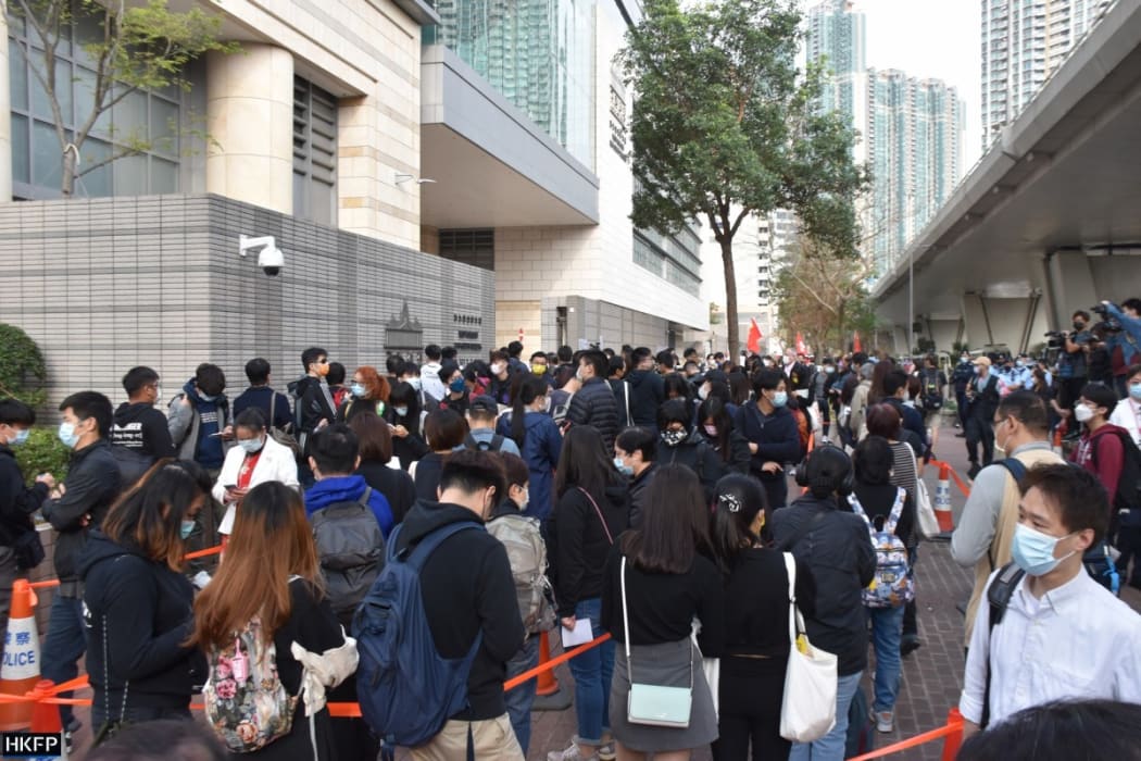 People queuing outside the West Kowloon Law Courts Building to hear the case of 47 democrats charged under the national security law.