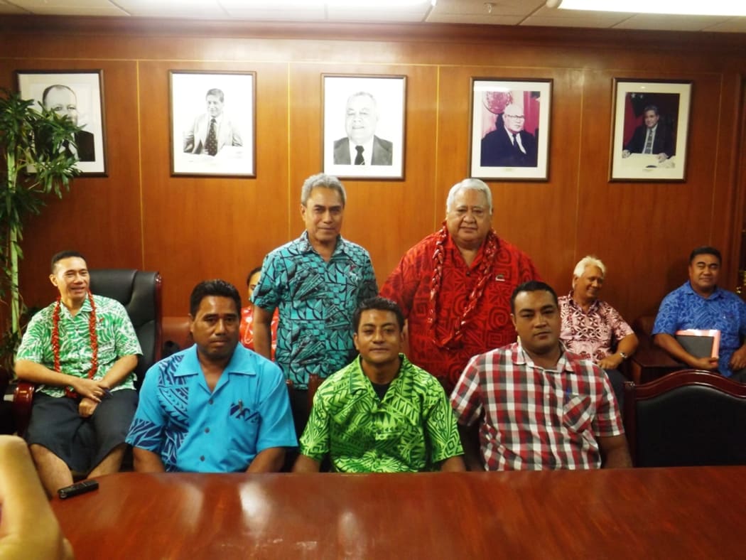 From right PM Tuilaepa Sailele Malielegaoi and Minister of Finance Sili Epa Tuioti, standing behind the first three carpenters from Samoa to work in Christchurch NZ.