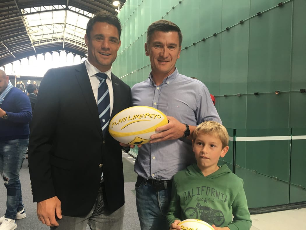 Dan Carter with Peyo's father Oliver, who is organising a memorial rugby match between Peyo's French and Kiwi friends.