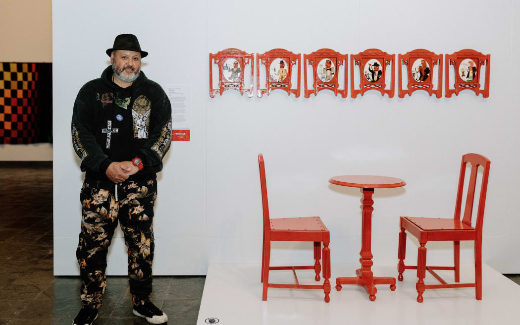 Winner of the National Contemporary Art Award 2023 Tawhai Rickard (Ngaati Uepohatu, Ngaati Porou) with his work titled ‘Scenes from a Victorian Restaurant’.