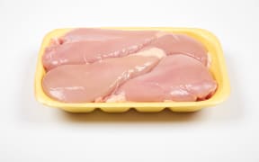 Raw chicken fillet package