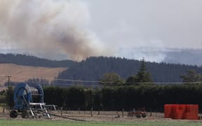 Clouds of smoke are seen rising from the bush fire area at Pigeon Valley this afternoon.