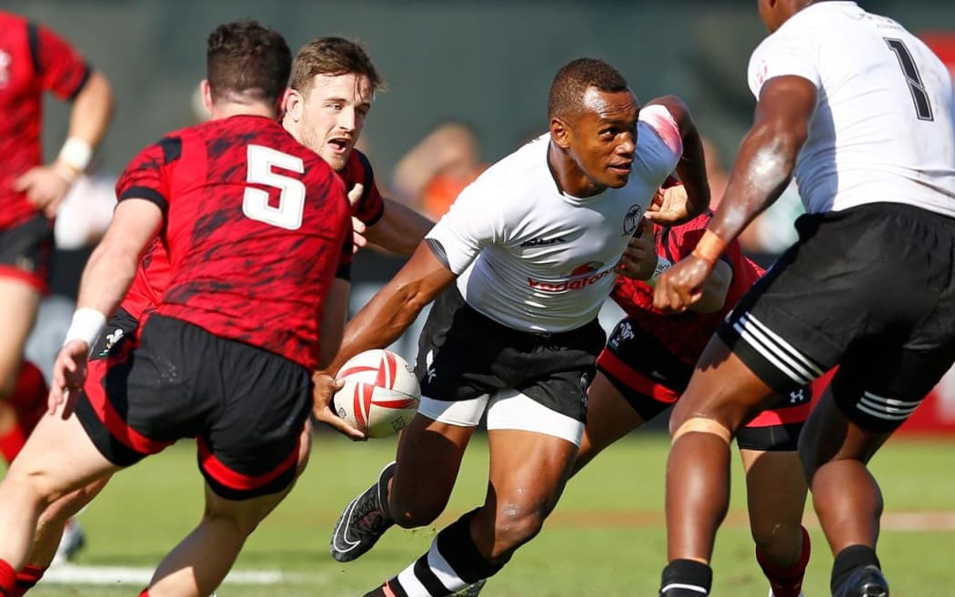 Fiji captain Osea Kolinsau finds space during the Dubai 7s.