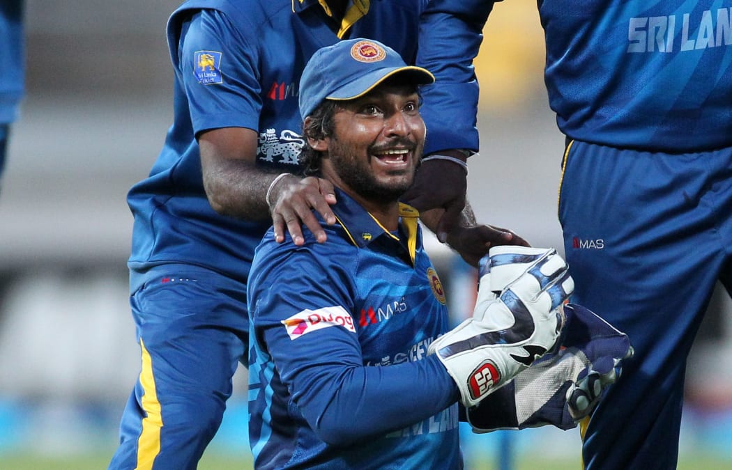 Sri Lankan Kumar Sangakkara celebrates breaking the record for most ODI dismissals by a wicketkeeper, Wellington 2015.