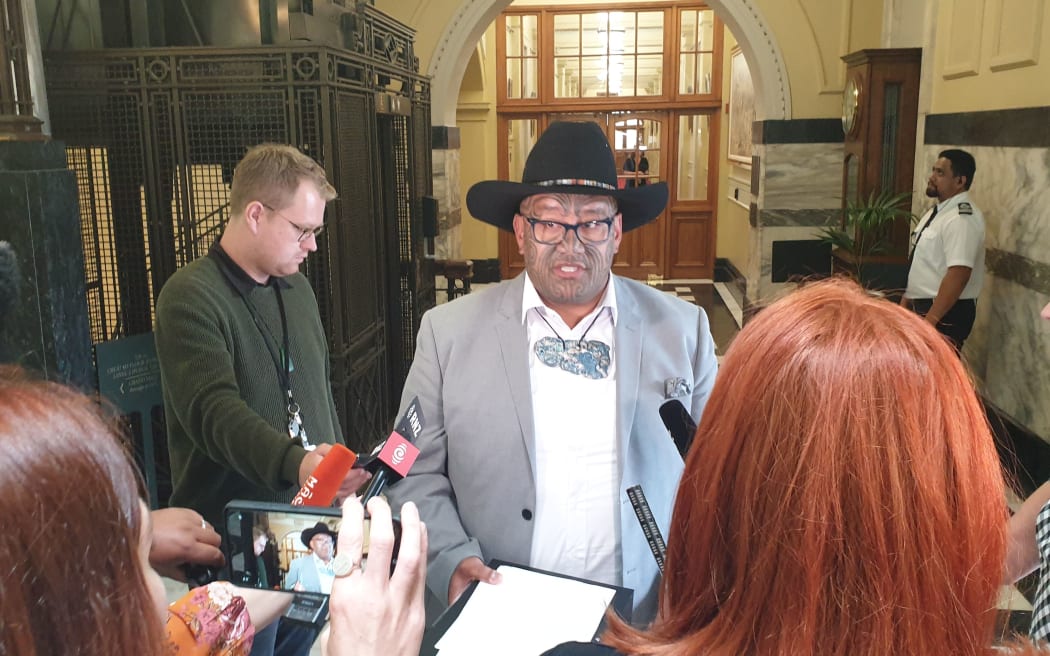 Rawiri Waititi speaks to media after being kicked out of the house by Speaker Trevor Mallard for not wearing a tie when asking questions.