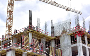 A new building is being constructed with use of tower crane