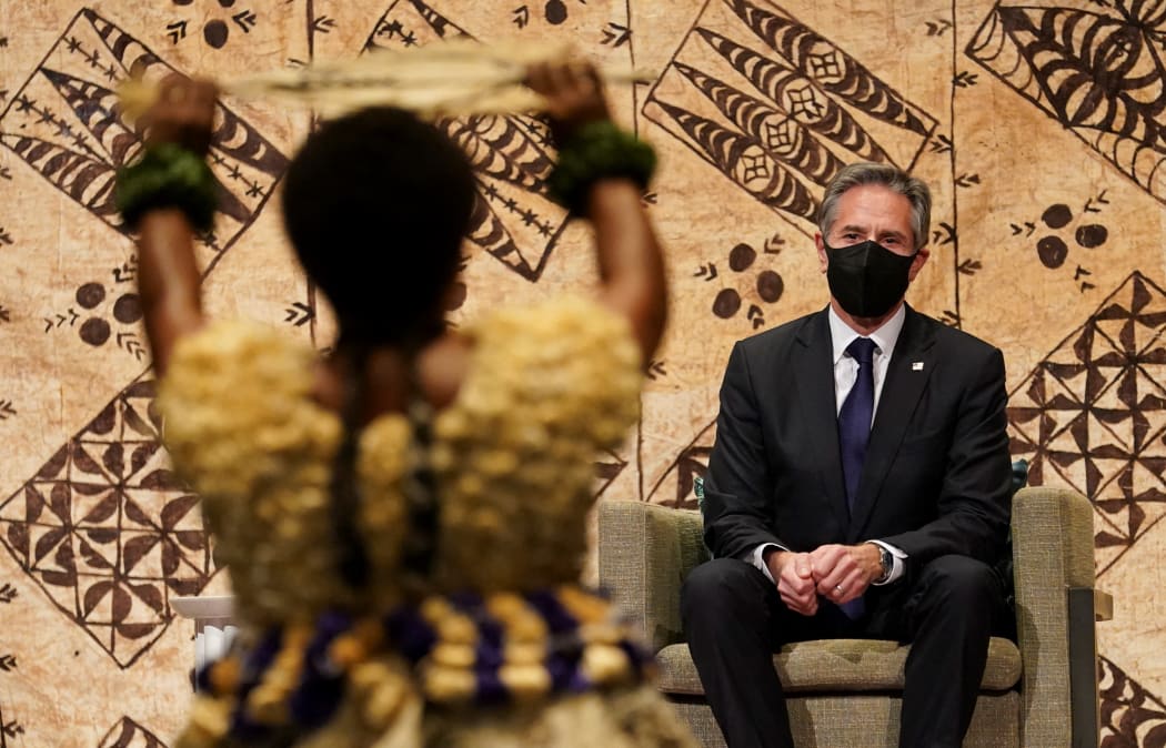 US Secretary of State Antony Blinken watches a cultural farewell ceremony during his visit to Nadi, Fiji on 12 February 2022.
