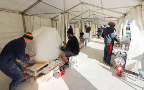 Stone carvers at a carving symposium in Manukau South Auckland.