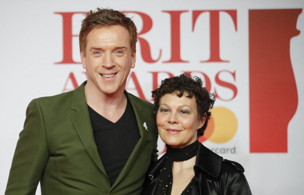 British actor Damian Lewis (L) and his wife Helen McCrory pose on the red carpet on arrival for the BRIT Awards 2018 in London on February 21, 2018. (Photo by Tolga AKMEN / AFP) / RESTRICTED TO EDITORIAL USE  NO POSTERS  NO MERCHANDISE NO USE IN PUBLICATIONS DEVOTED TO ARTISTS
