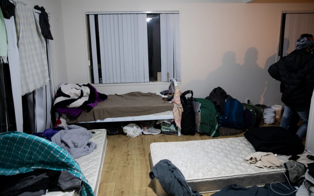 Many workers are sleeping on the floor.