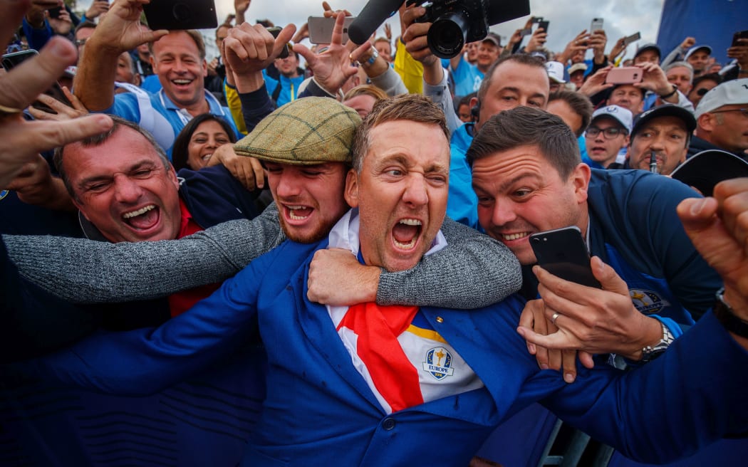 Ian Poulter celebrates winning the 2018 Ryder Cup with fans