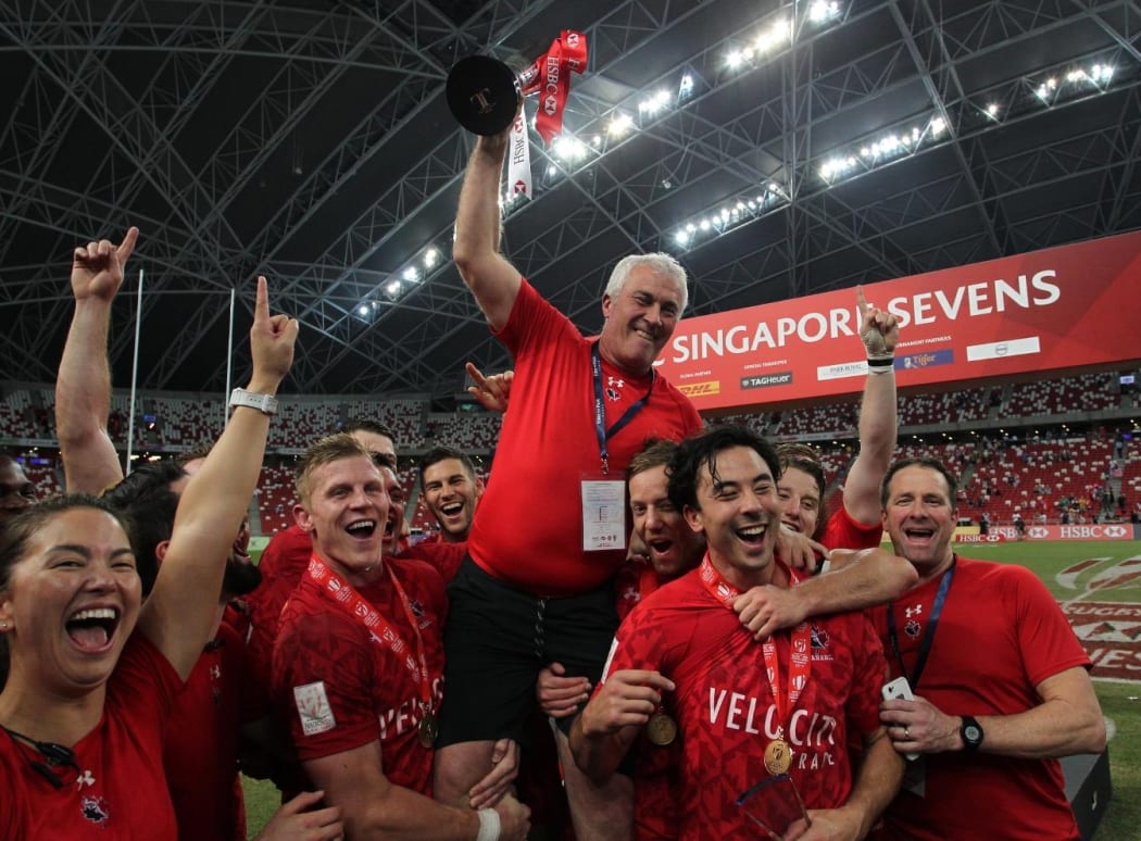 Canada celebrate winning their maiden World Sevens Series tournament in Singapore.