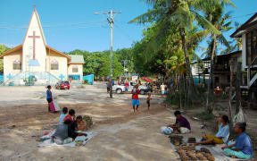 Village market near christian church building, Papua New Guinea