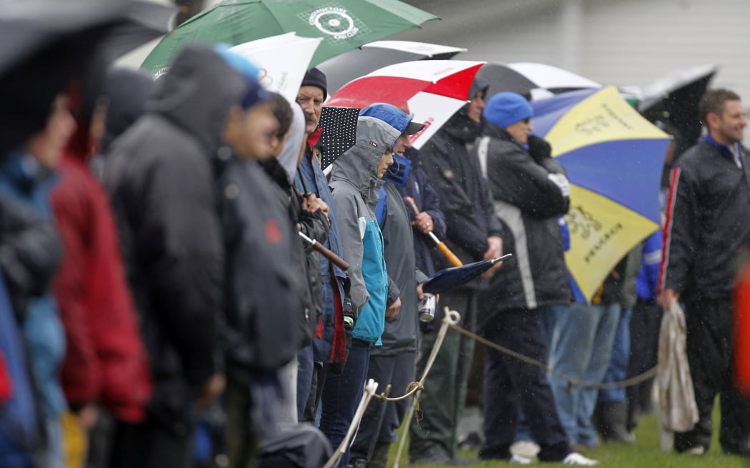 Fans brave the weather.