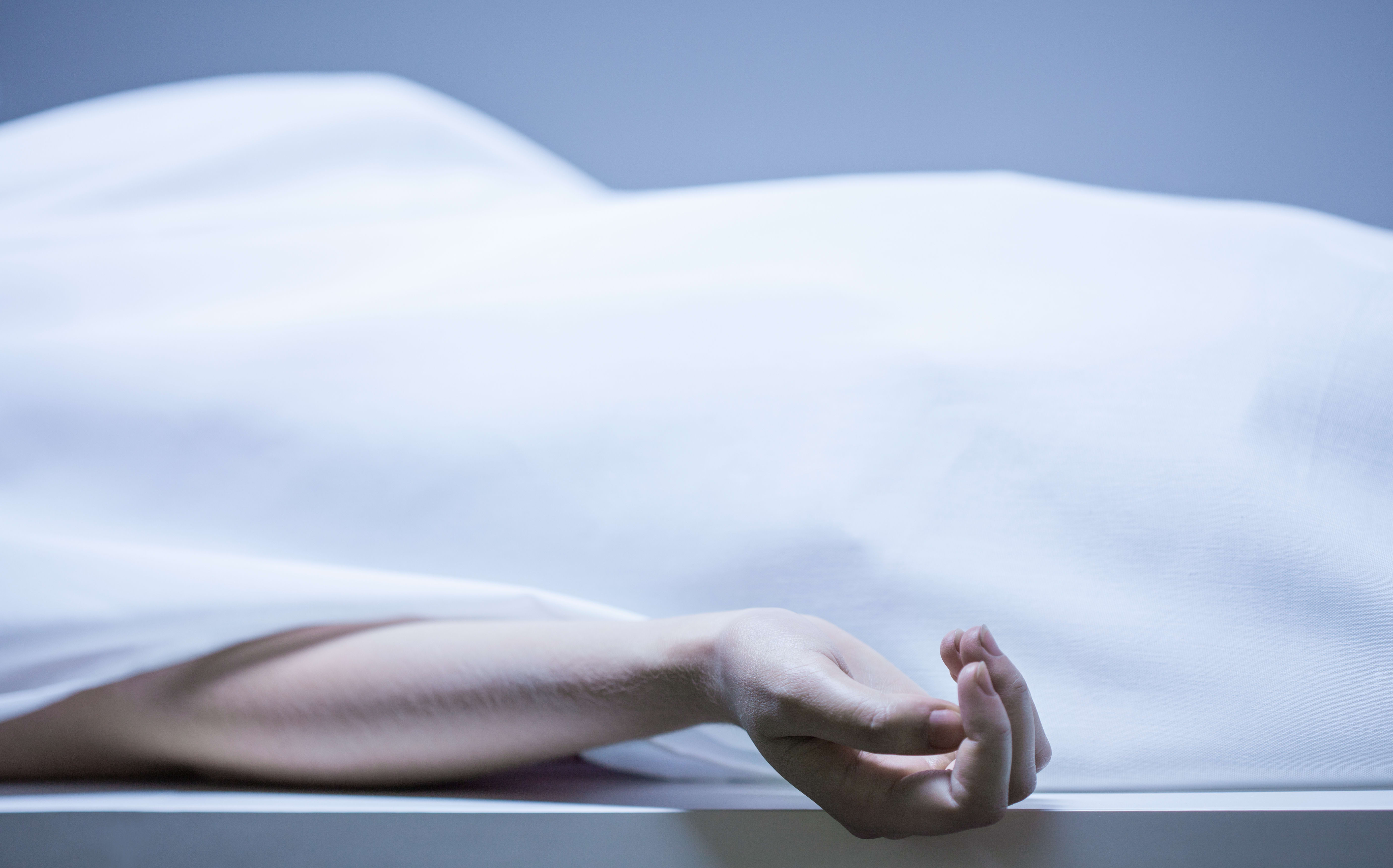 Remains of person in the morgue, horizontal