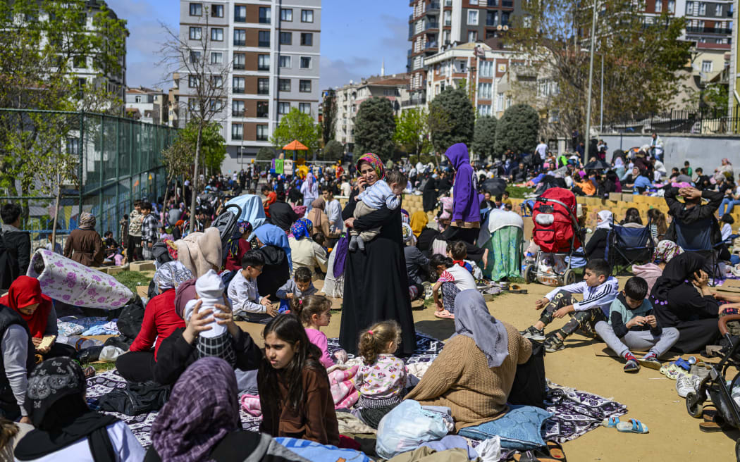 Local residents wait in a park in Istanbul on April 23, 2025, following an initial quake at 12:49 pm (0949 GMT) followed by three others of with magnitudes of 4.4 to 4.9. An earthquake with a magnitude of 6.2 hit the Marmara Sea near the western outskirts of Istanbul on April 23, 2025, officials said, with the impact felt across Turkey's largest city where people rushed onto the streets.