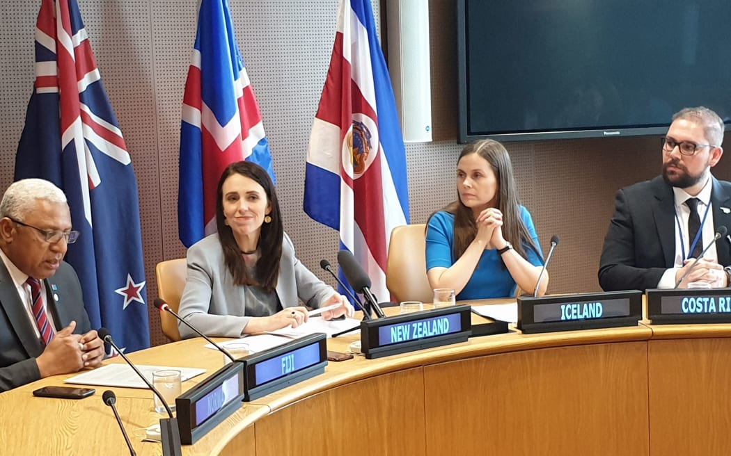 The leaders of Norway (not visible), Fiji, New Zealand, Iceland and Costa Rica announce plans for climate trade negotiations.