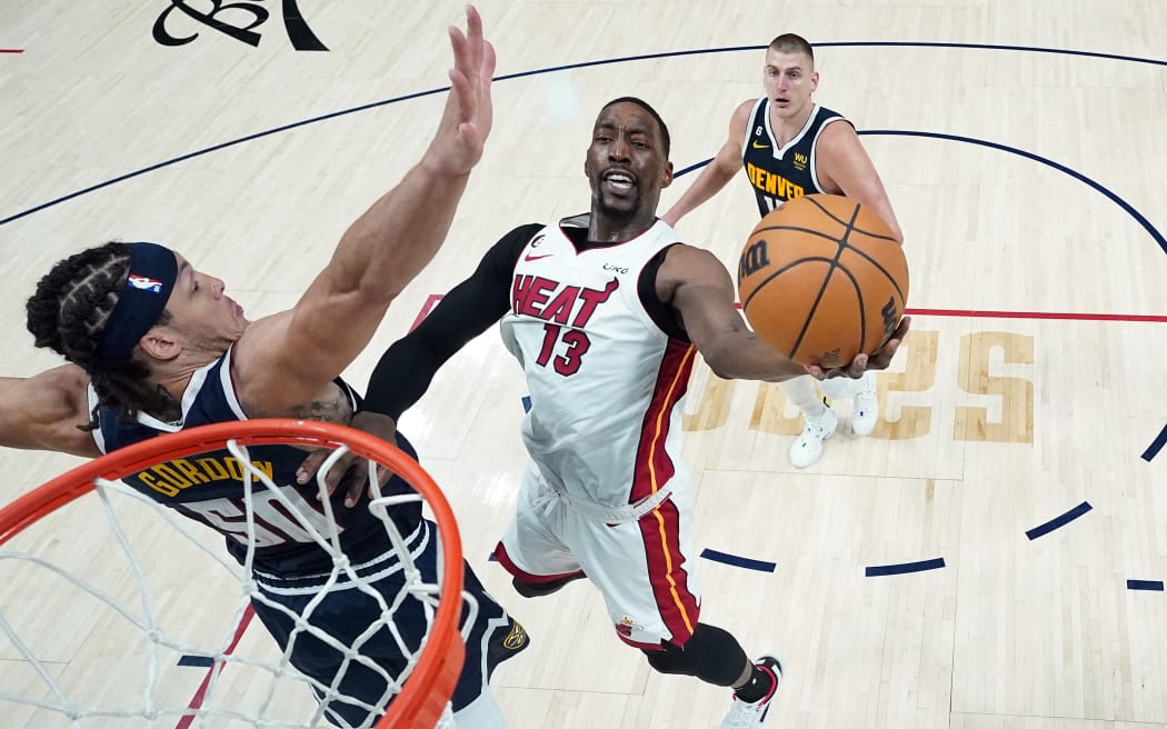 Bam Adebayo of the Miami Heat drives to the basket against Aaron Gordon of the Denver Nuggets during Game Two of the NBA Finals in Denver.