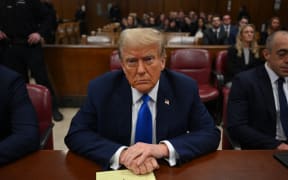 Former US president and Republican presidential candidate Donald Trump looks on at Manhattan Criminal Court during his trial for allegedly covering up hush money payments linked to extramarital affairs in New York on April 22, 2024. Donald Trump's unprecedented criminal trial is set for opening statements after final jury selection ended Friday, leaving the Republican presidential candidate facing weeks of hostile testimony that will overshadow his White House campaign. (Photo by ANGELA WEISS / POOL / AFP)