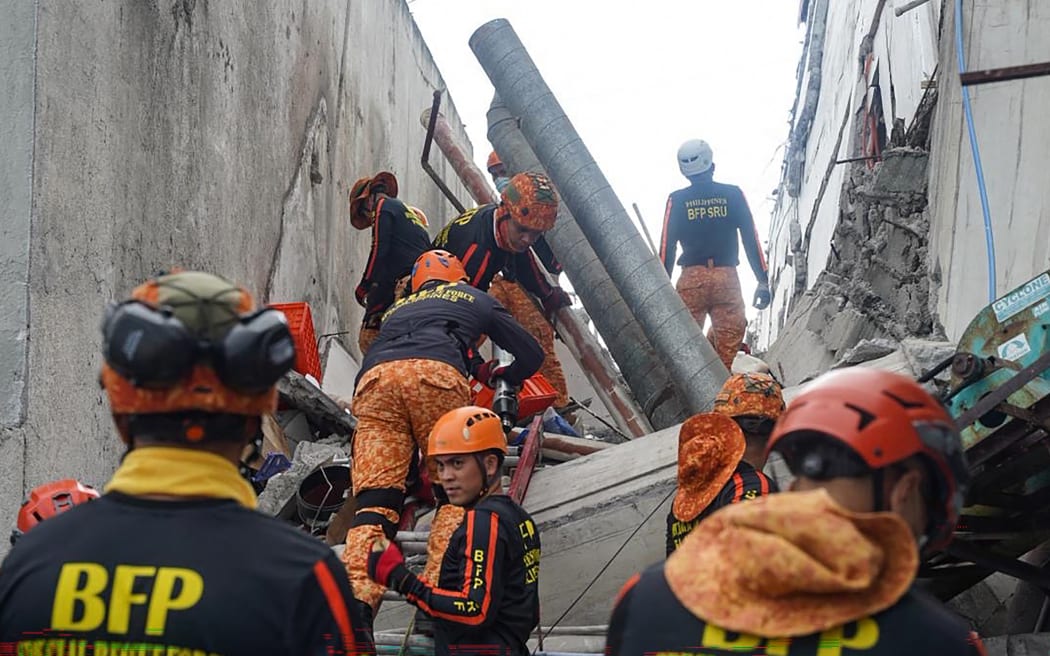 Responders conduct a rescue operation at a collapsed building after a 7.8 magnitude earthquake in General Santos City on June 8, 2026. A 7.8-magnitude earthquake struck the southern Philippines on June 8, killing at least 15 people, collapsing buildings and sparking tsunami warnings across the region.